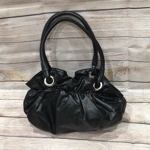 Black faux leather bag with ruffle top